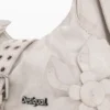 Borsa con applicazioni floreali