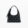 Borsa in ecopelle con borchie