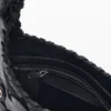 Borsa in ecopelle con borchie