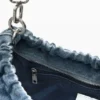 Borsa ovale media con ciondoli