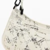 Borsa piccola intrecciata con scritte