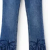 Jeans lunghi a zampa ricamati Jeans lunghi a zampa ricamati