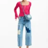 Pantaloni in denim con toppe all’uncinetto