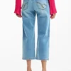 Pantaloni in denim con toppe all’uncinetto