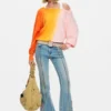 Pantaloni jeans con impunture a fiori