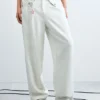 Pantaloni larghi con bottoni