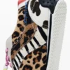Sneaker patchwork con stampa animalier