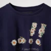 T-shirt corta con margherite