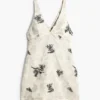 Vestito con spalline ricamate e rami