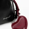 Zaino medio con ciondolo a forma di cuore Zaino medio con ciondolo a forma di cuore