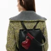 Zaino medio con ciondolo a forma di cuore Zaino medio con ciondolo a forma di cuore